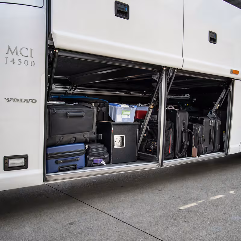 Party bus interior with wraparound leather seating and LED lighting in New Orleans