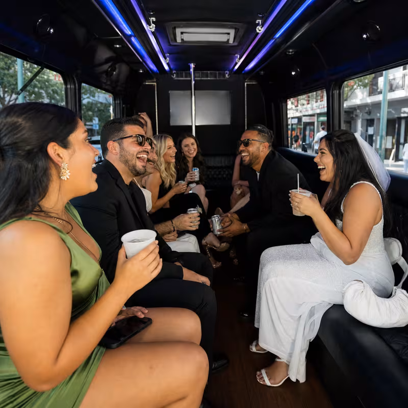 Party bus interior with wraparound leather seating and LED lighting in New Orleans