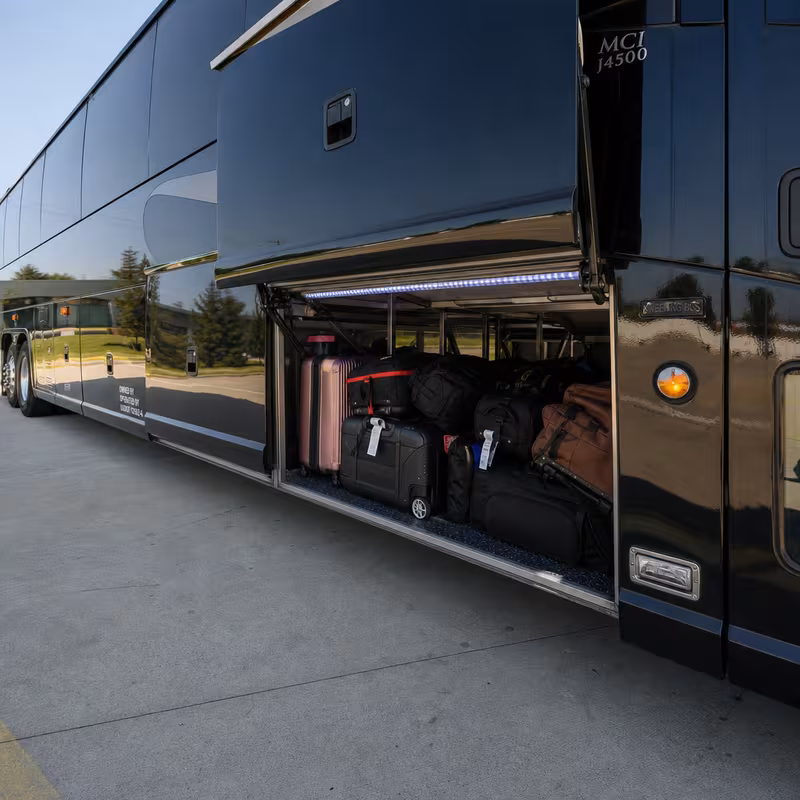 Party bus interior with wraparound leather seating and LED lighting in New Orleans